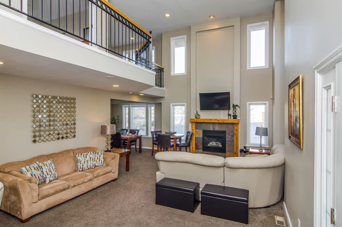 Family room of with sectional and fireplace of Union Cove home