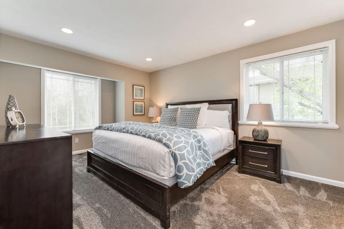 Master bedroom with king bed in Union Woods home