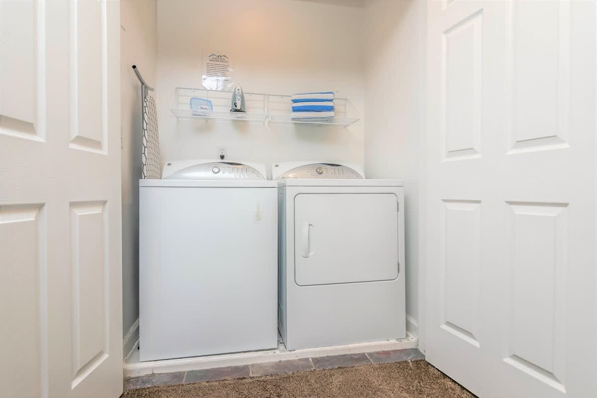 Laundry closet upstairs in Union Spruces home
