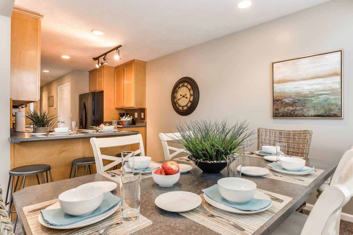 Dining table and bar seating in Union Woods home