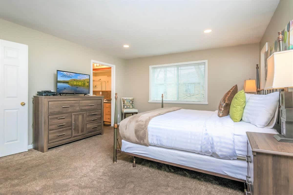 Master bedroom with king bed in Union Spruces home