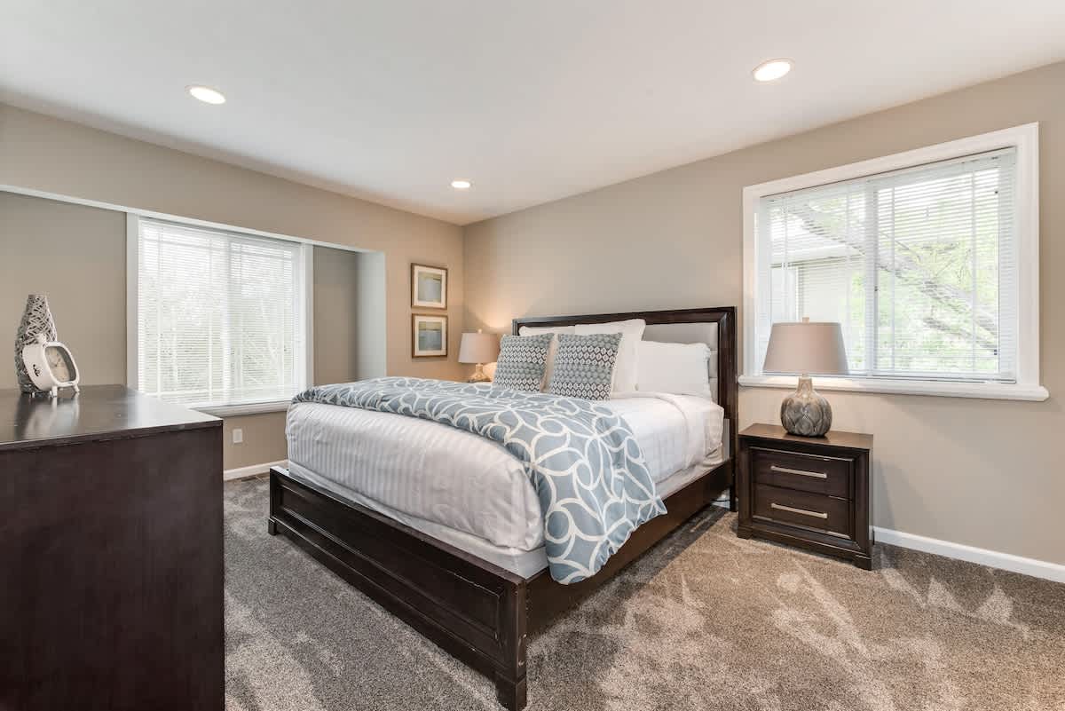 Master bedroom with king bed in Union Woods home