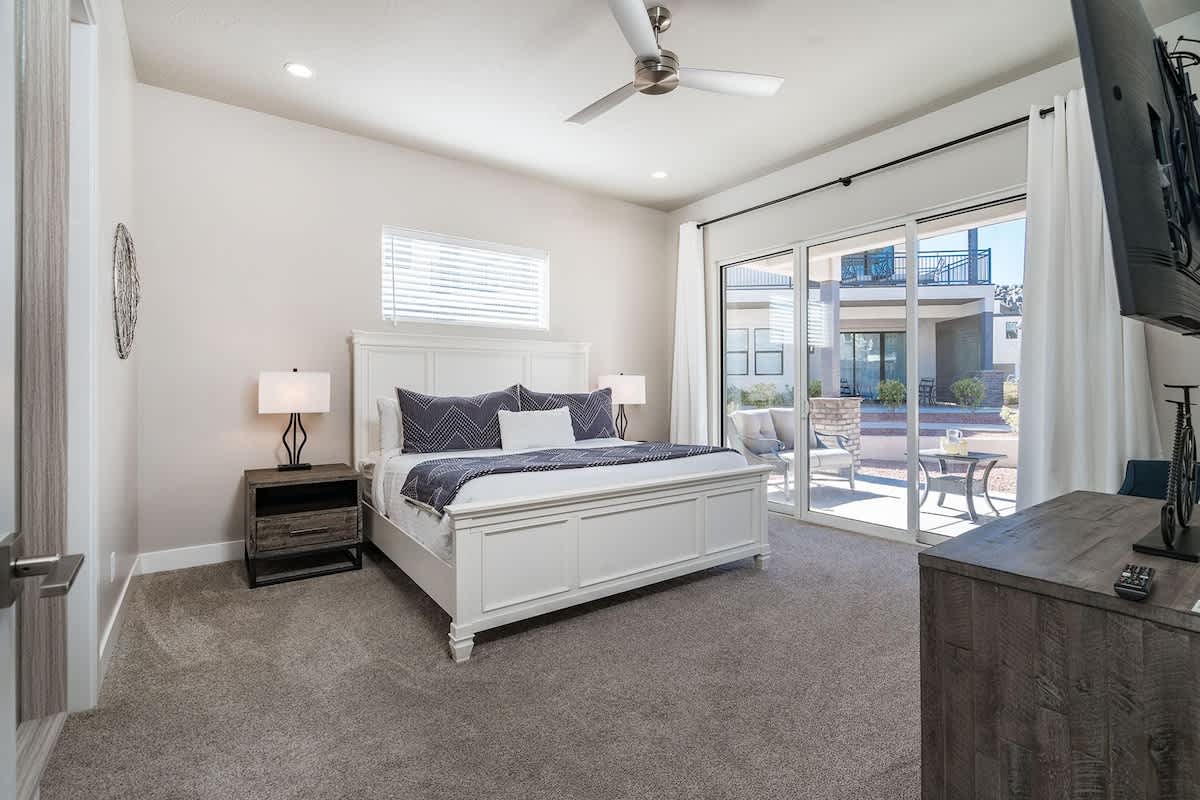 Master bedroom on main with king bed and private pool access