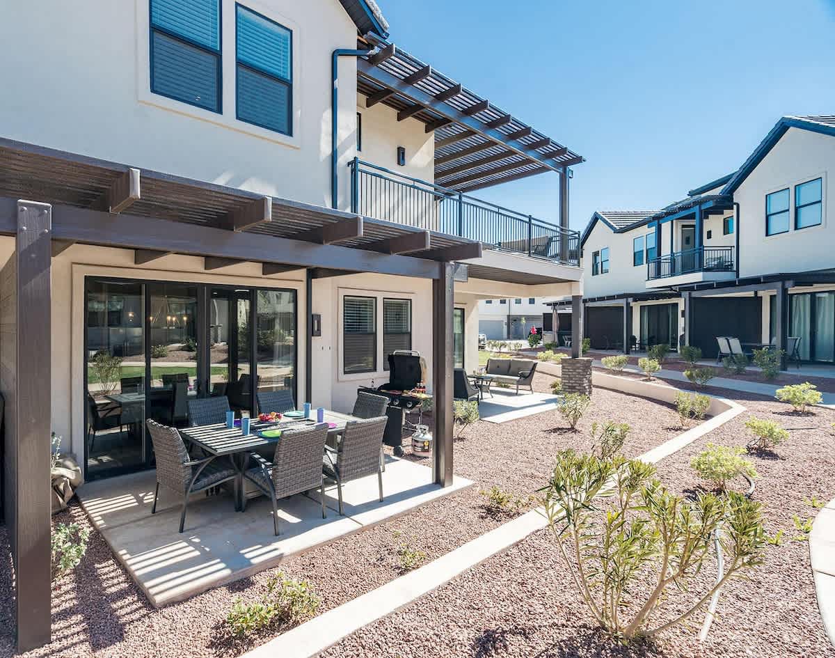 Outdoor dining set with BBQ and upper balcony