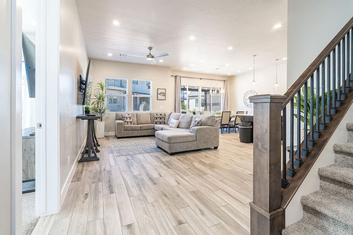 Gorgeous open concept family room and kitchen with sectional