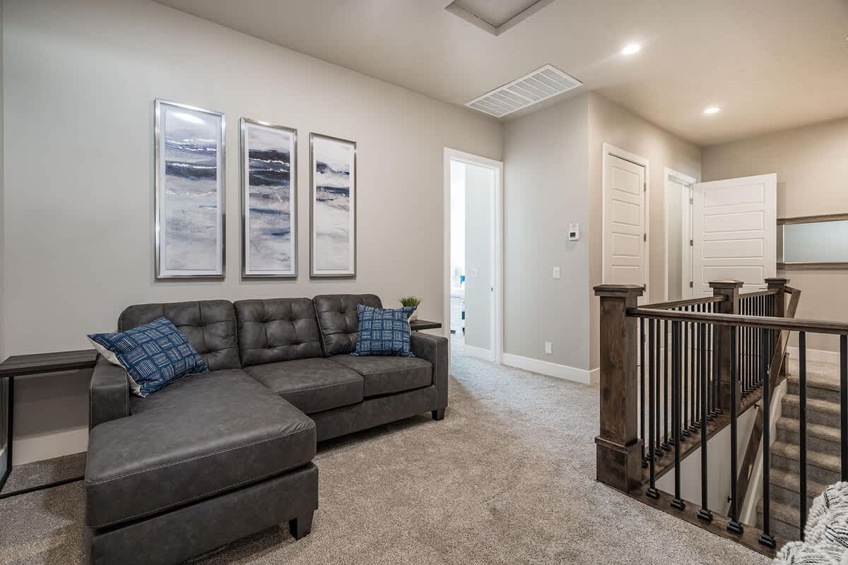Upstairs family room sofa sleeper and large TV