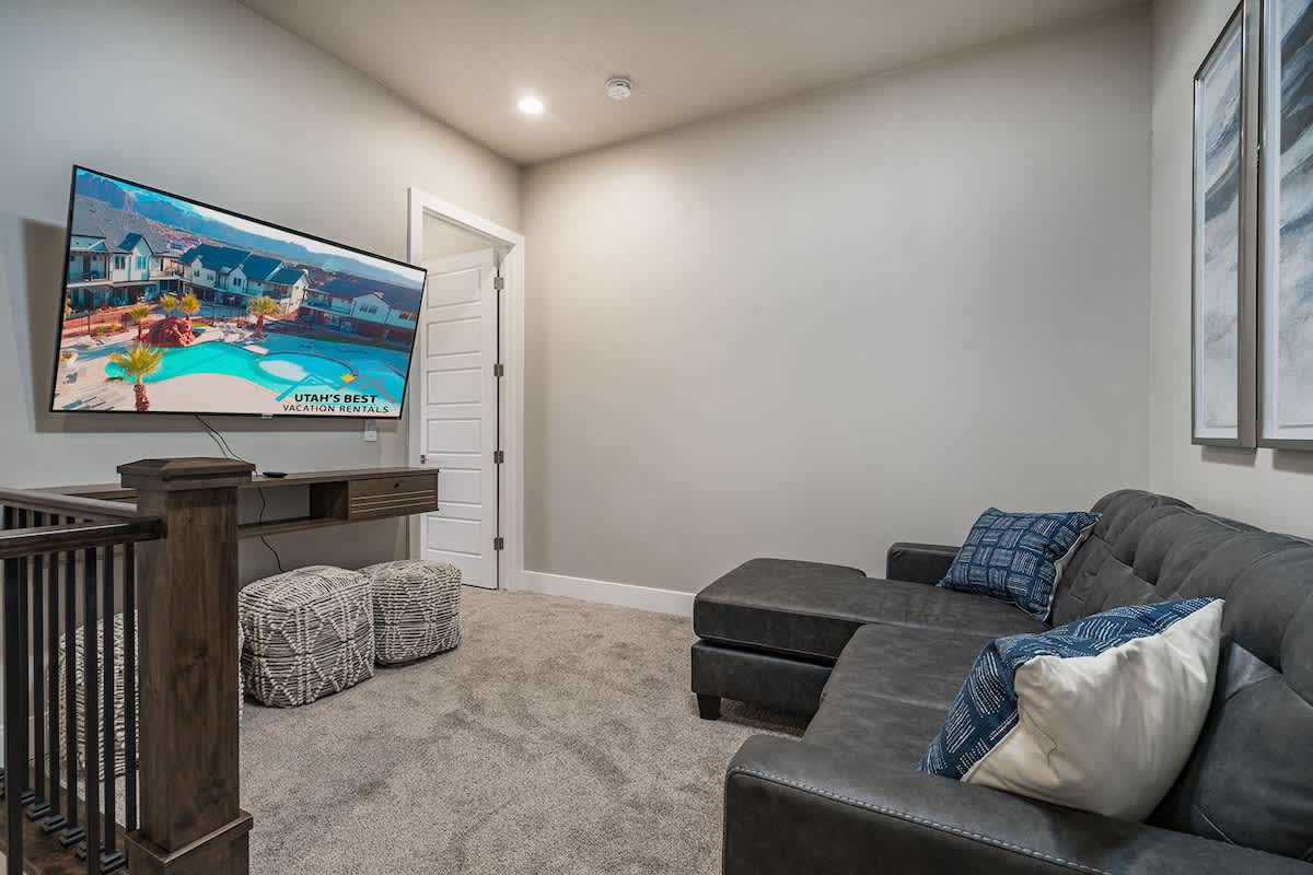 Upstairs family room sofa sleeper and large TV