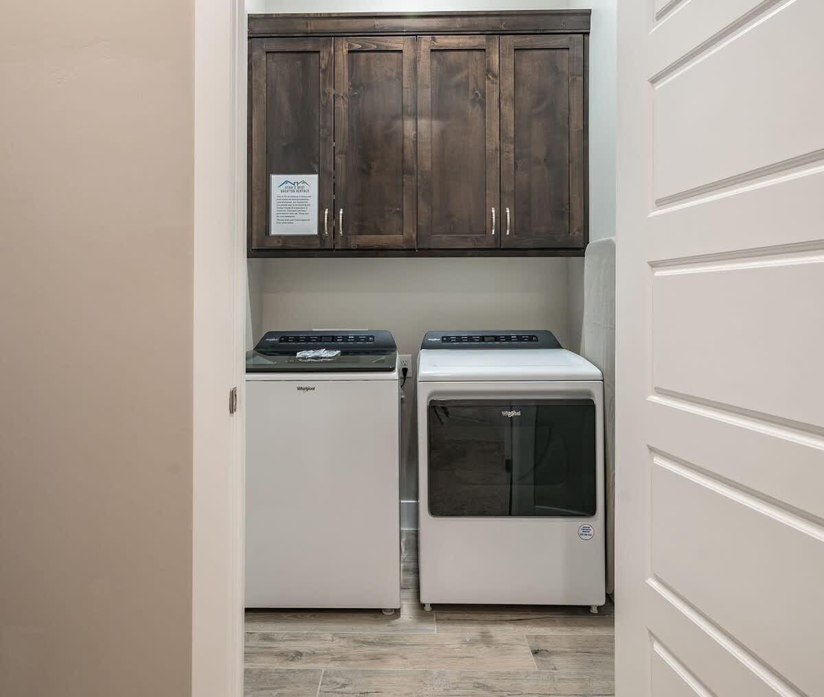 Laundry room with washer and dryer provided
