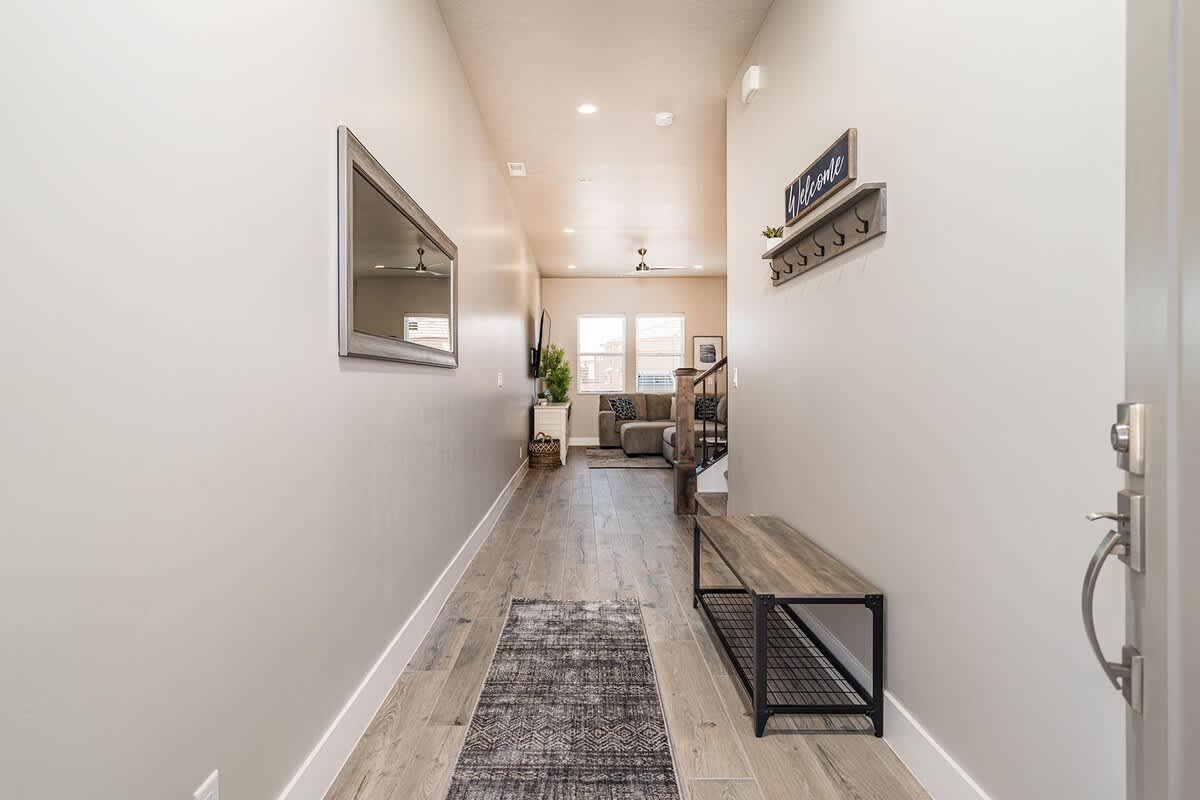 Beautiful entry foyer with bench and hooks