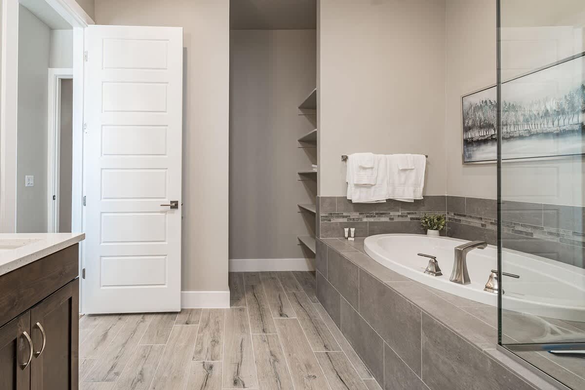Master bathroom with tub and shower