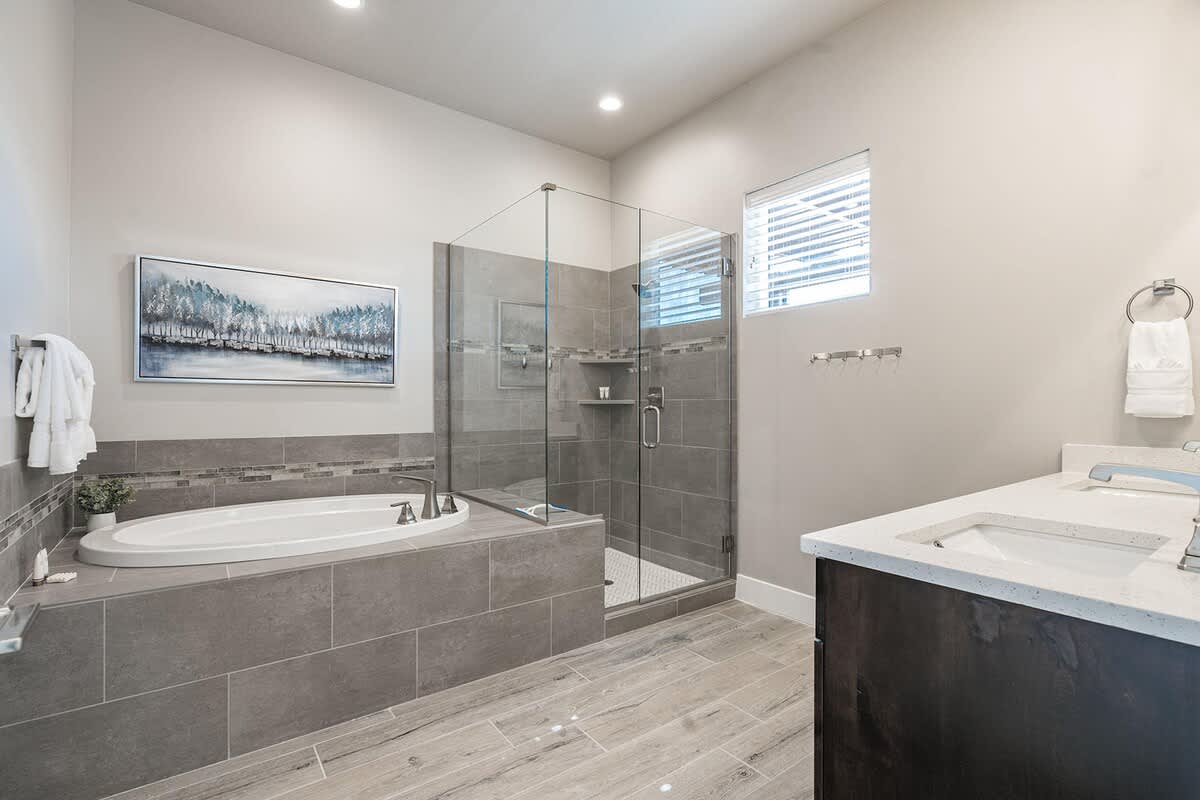 Master bathroom with tub and shower