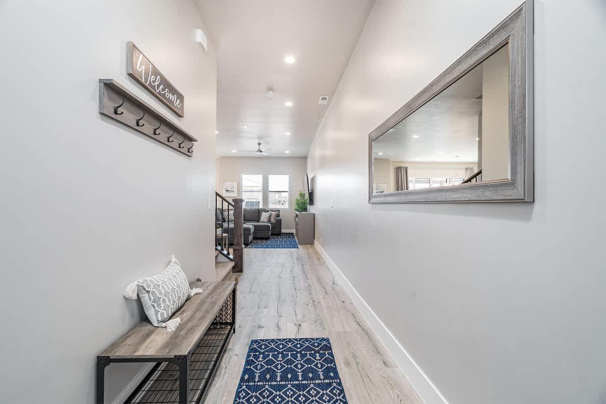 Beautiful front entry foyer with bench and hooks