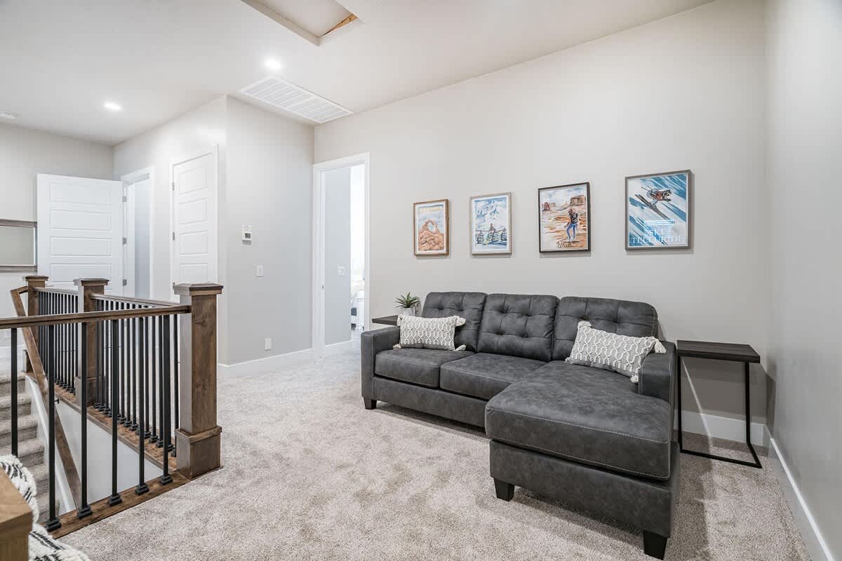 Upstairs small family room loft area with TV and sofa sleeper