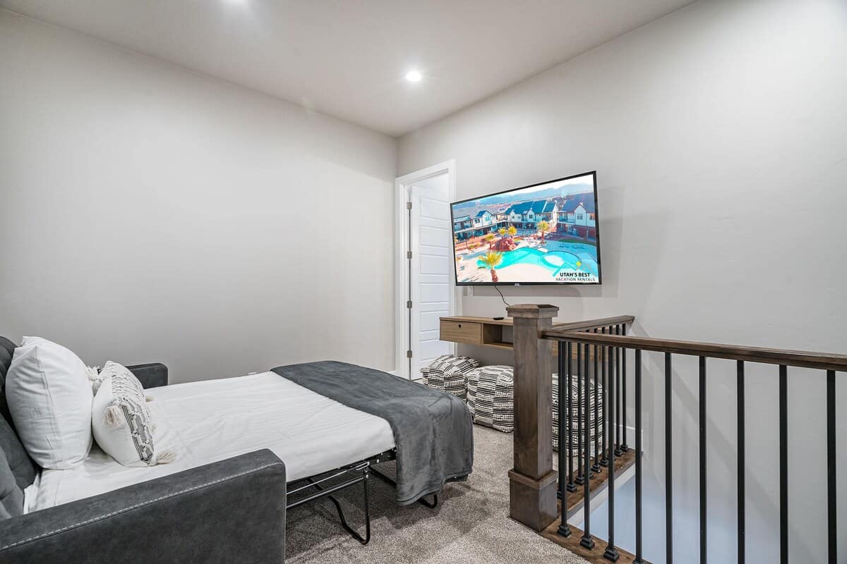 Upstairs family room with sofa sleeper and TV