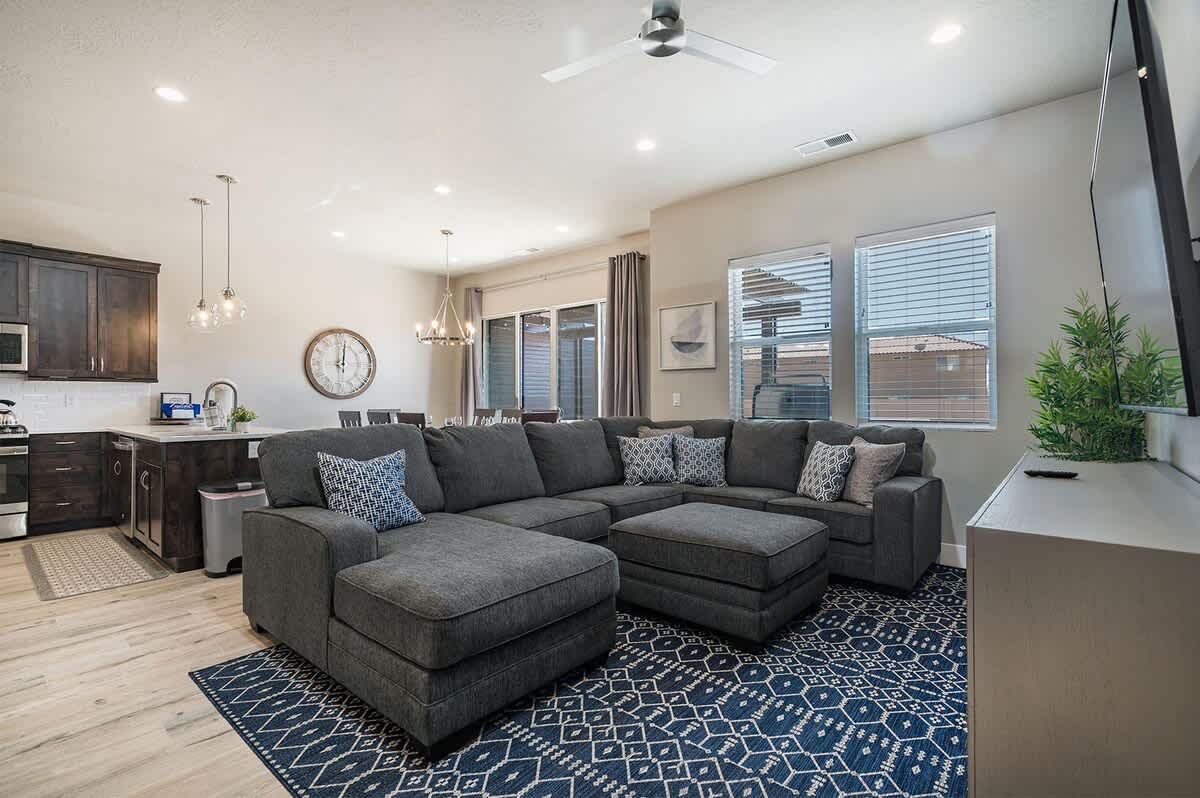 Main family room with comfortable sectional sofa and TV