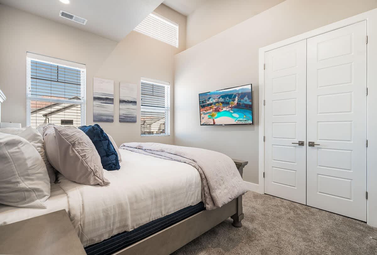 House #50 bedroom 2 with TV and king bed