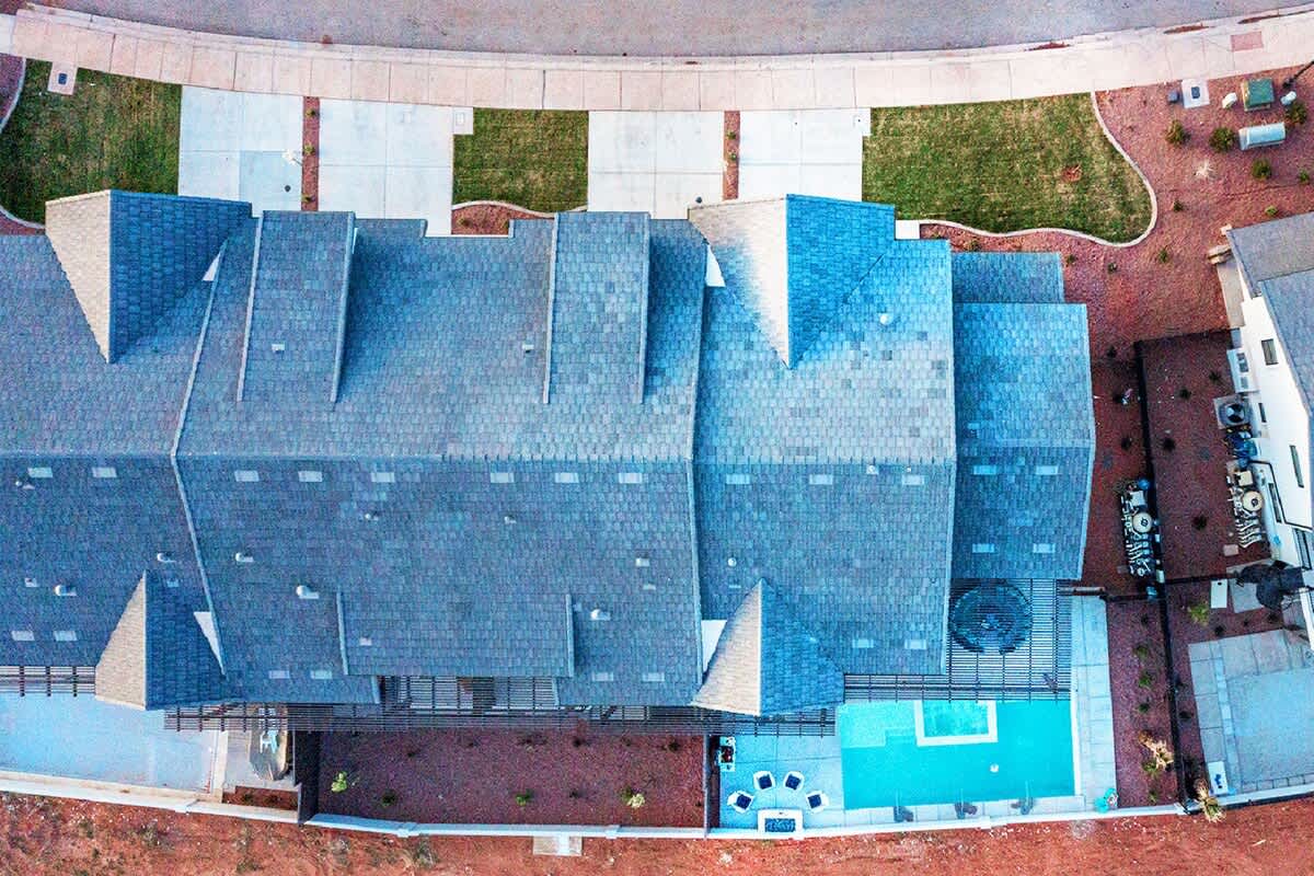Bird's eye view of the home and 2 connecting homes next door