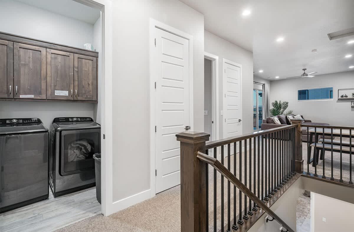 Upstairs hallway and laundry with a second family room