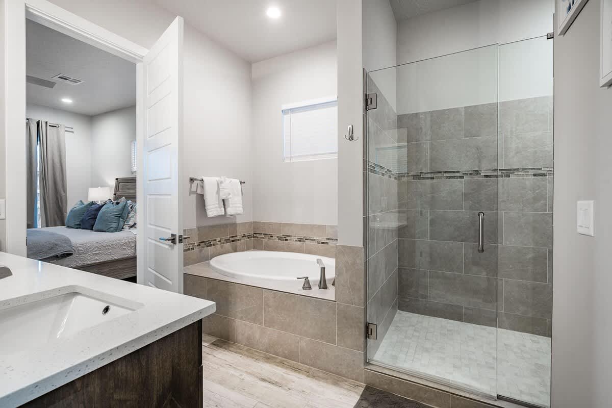 Master bathroom with tub and shower