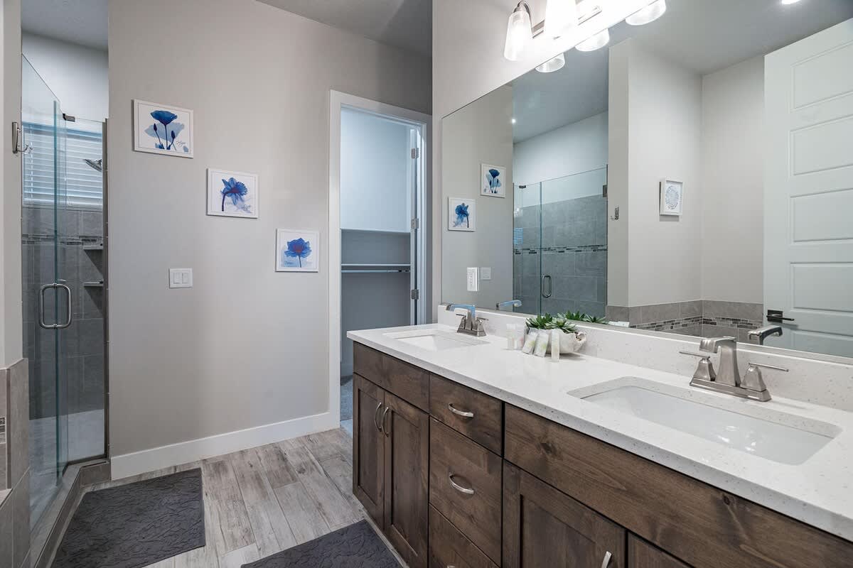 Master bathroom with dual sink vanity, shower and tub