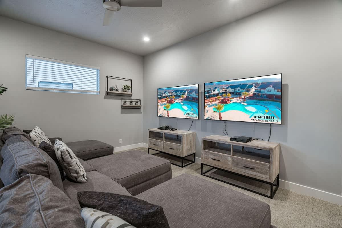 Family room with 2 TVs and PS4s