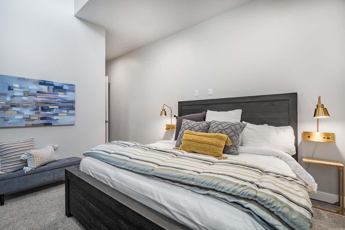 Bedroom 2 with king bed and bench