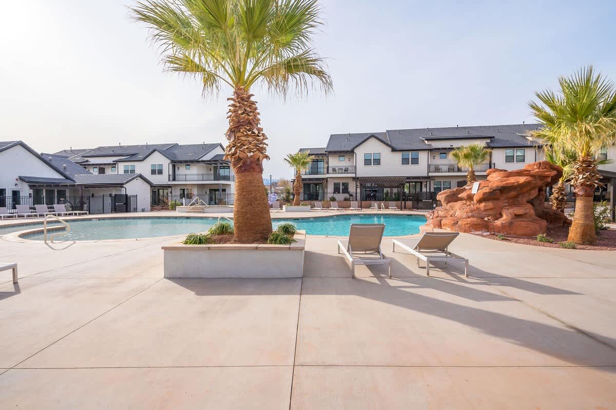 Community hot tub and pool with rock water slide