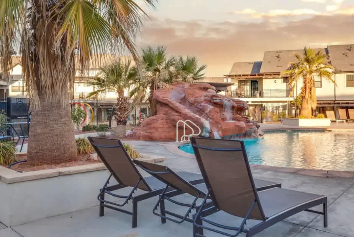 Community rock slide with lounge chairs