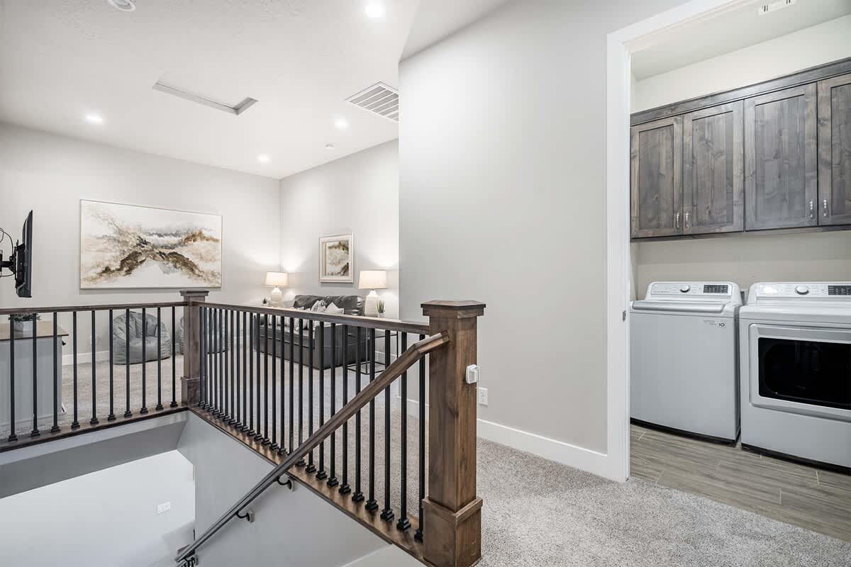 Upstairs hallway and laundry with a second family room