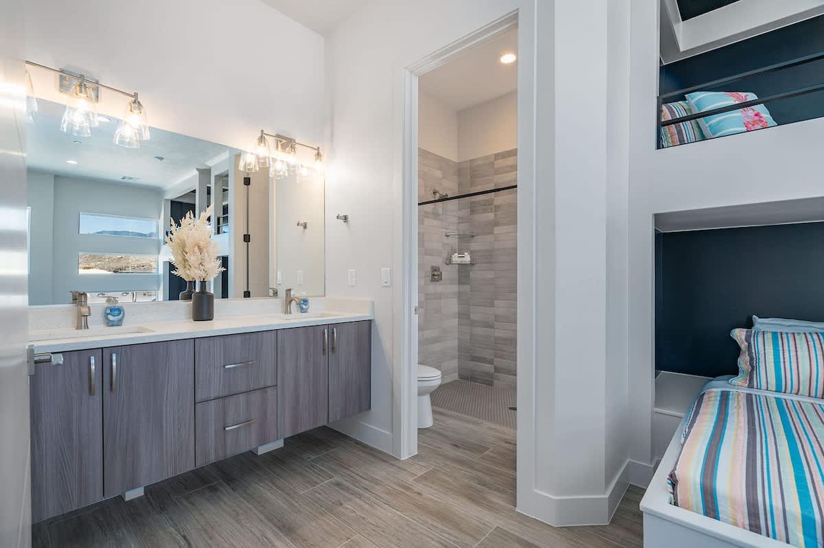 Private bathroom in bunk room 1 with dual sinks and shower