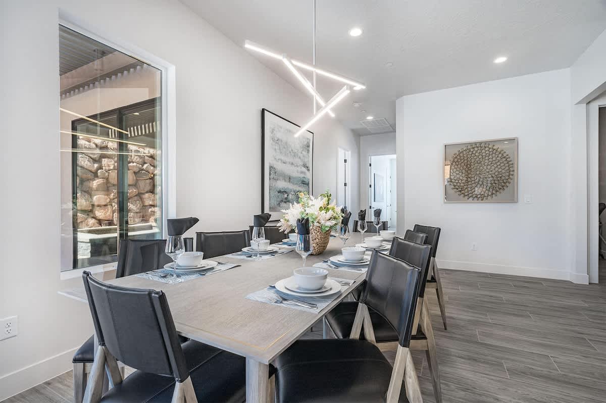 Dining table seats 10 and is open to the kitchen area