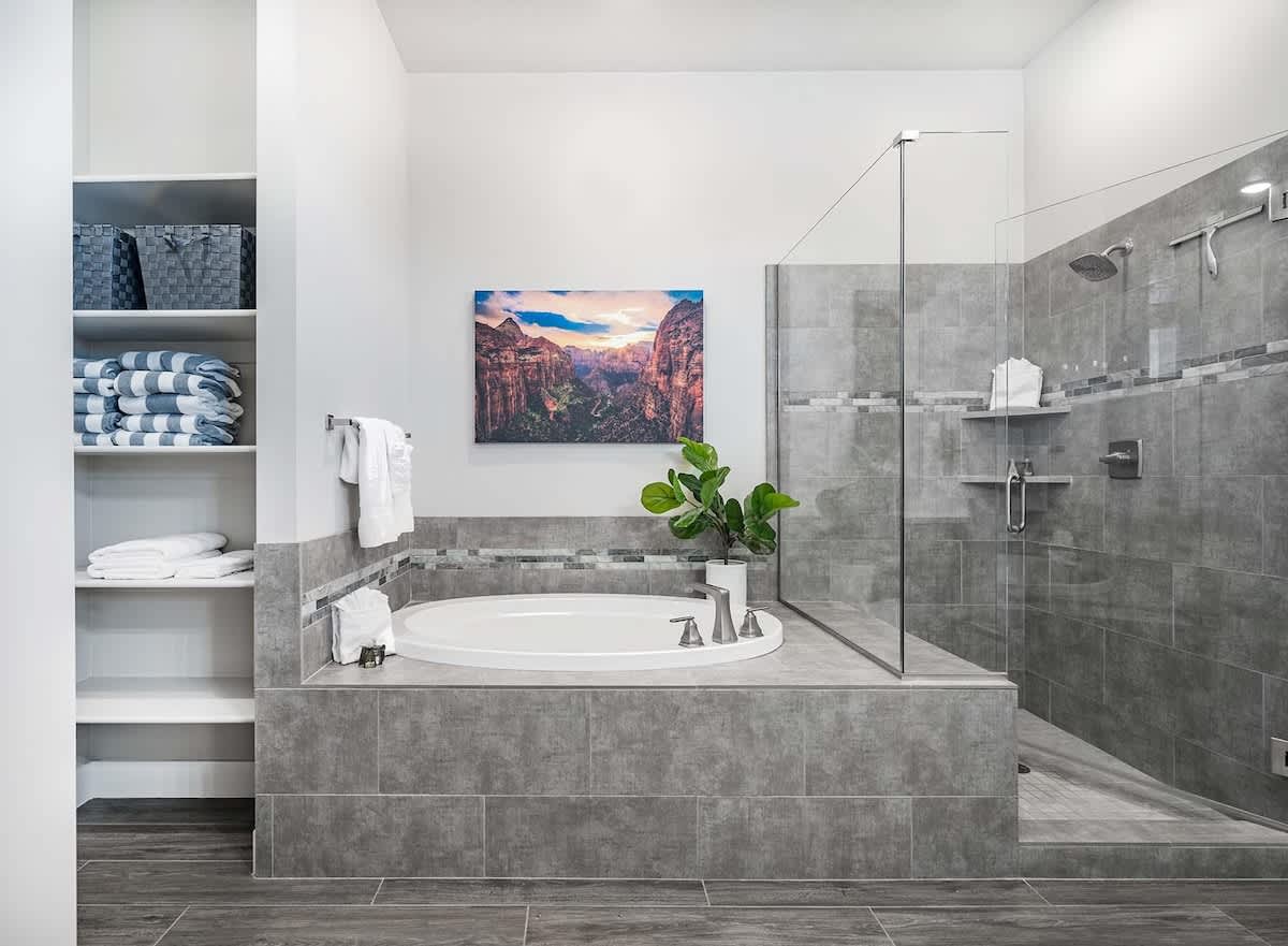 House #66 master bathroom with walk in shower and tub