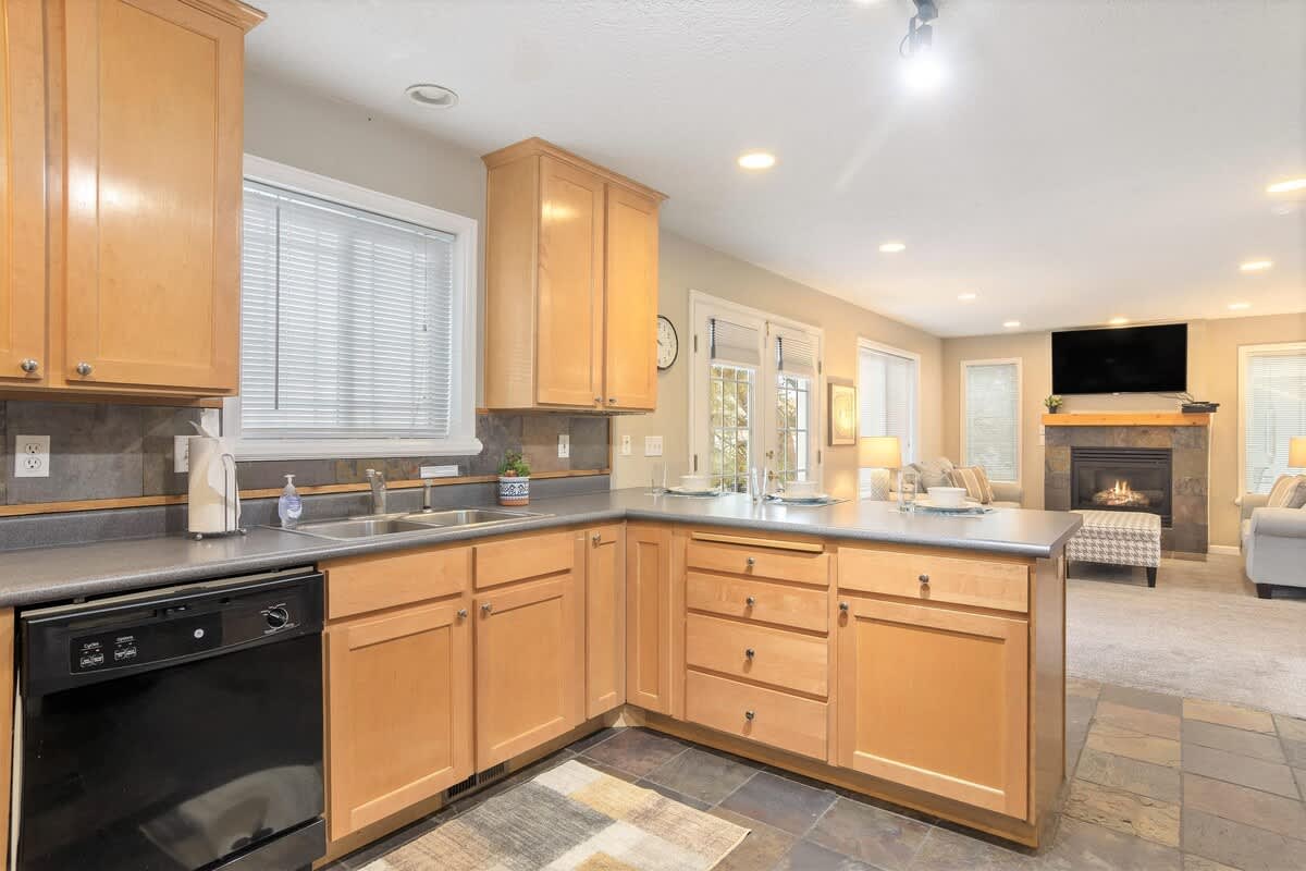 House 2 kitchen open to living room TV lounge area