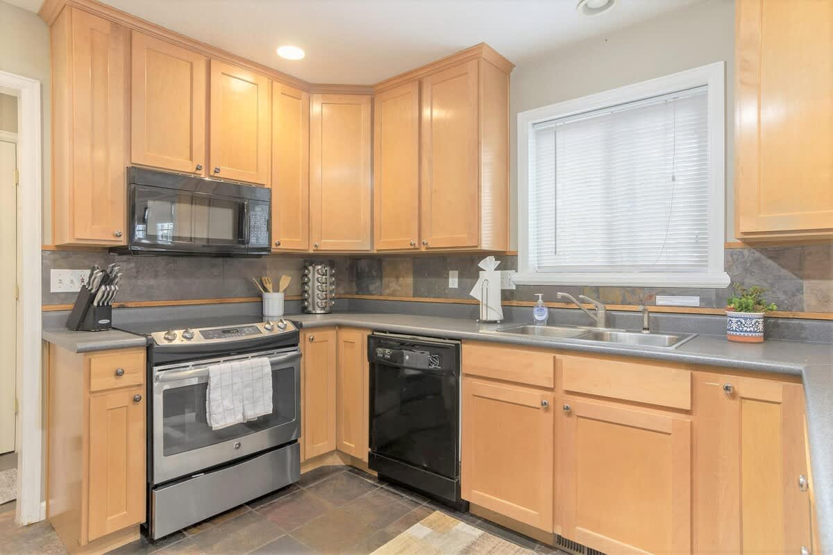 House 2 kitchen with spice rack and coffee maker (in both units)