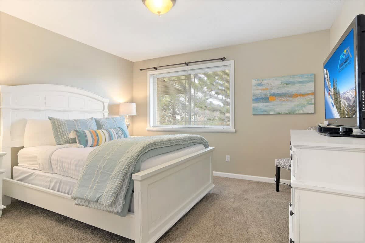 House 2 bedroom 3 with queen bed, dresser and TV