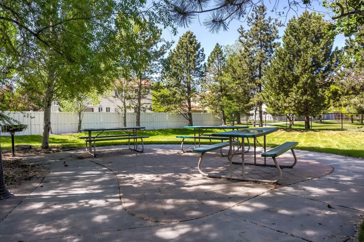 Common area green space with picnic table sits right next door