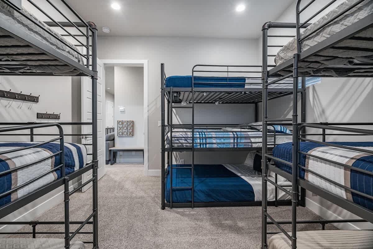 61 - Bedroom 5 with three triple bunk beds