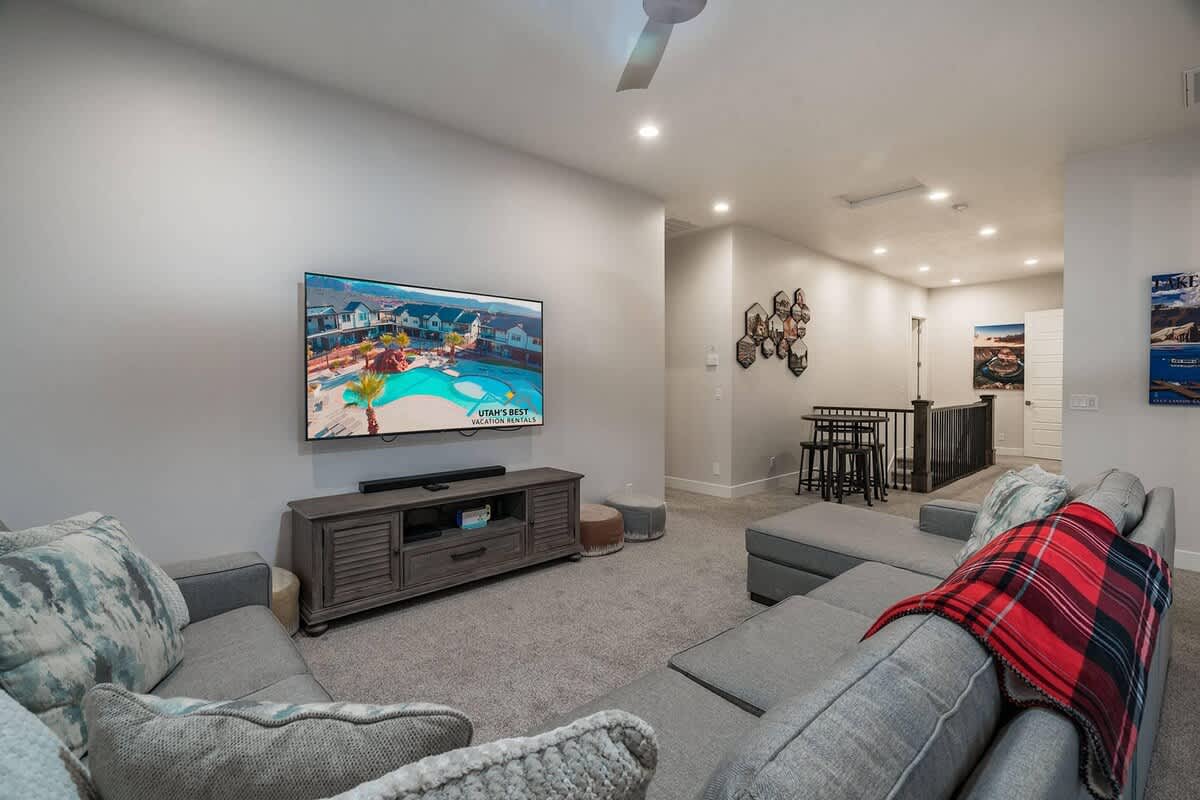62 - Large TV and sectional sofa in upstairs family room