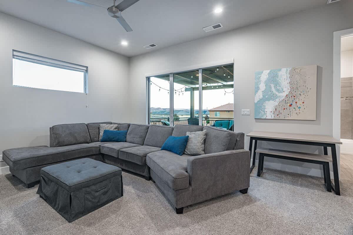 61 - Upstairs family room with large sofa, sofa sleeper, and two