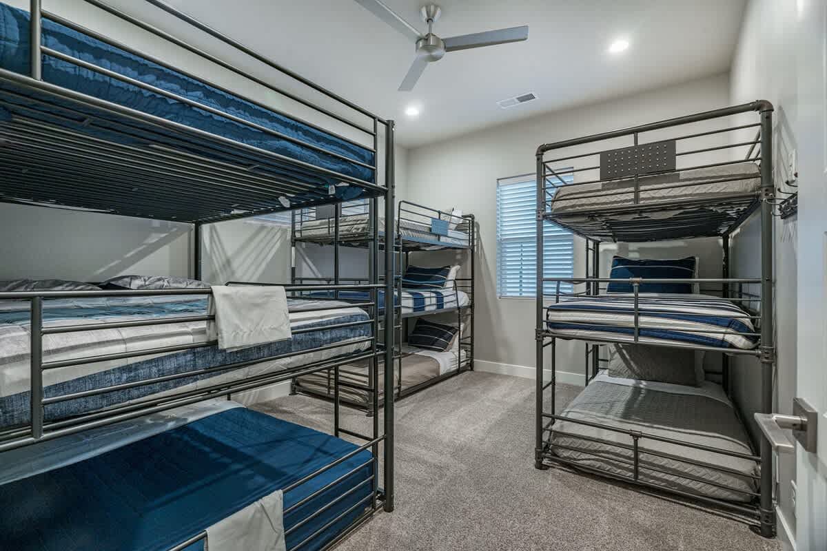 61 - Bedroom 5 with three triple bunk beds
