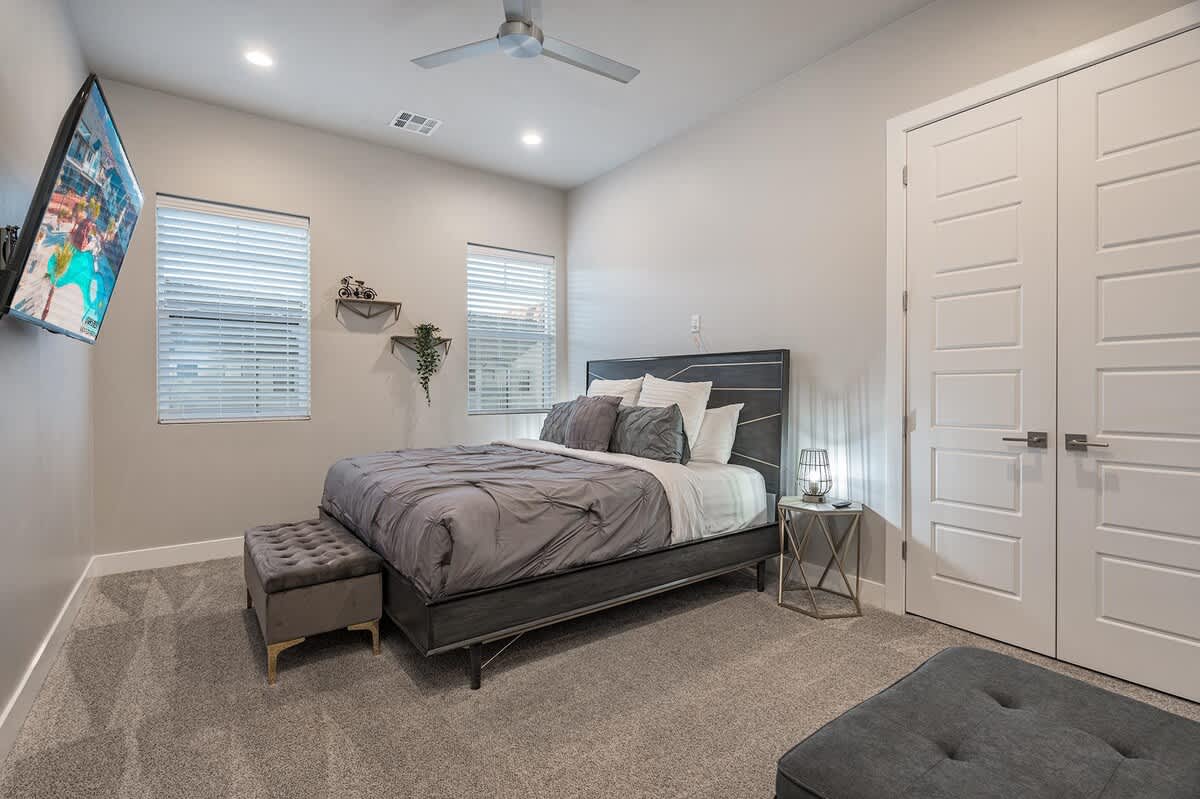Bedroom 2 with king bed and TV