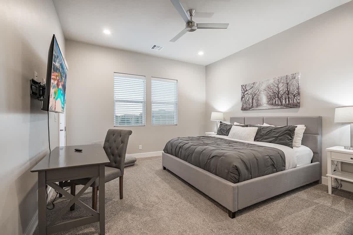 Bedroom 3 with king bed, TV and desk