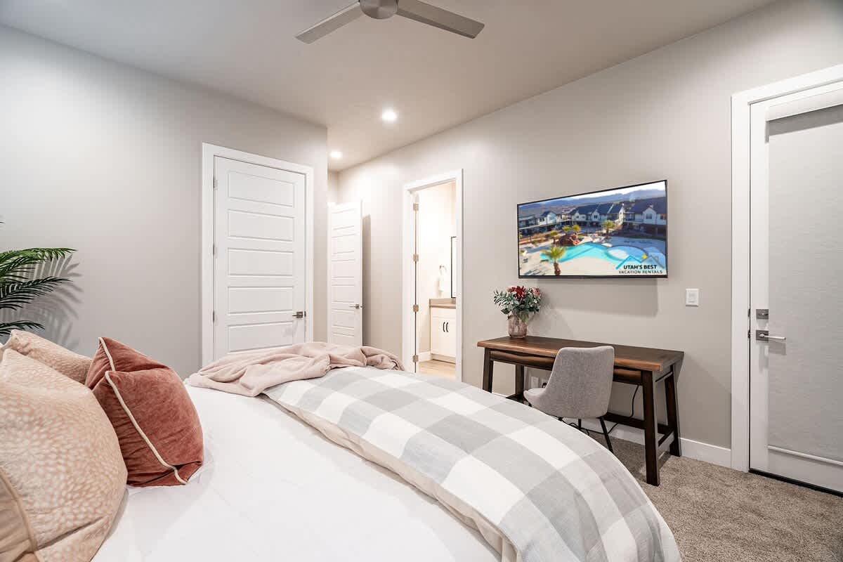 30 - Bedroom 4 has a small desk and large TV