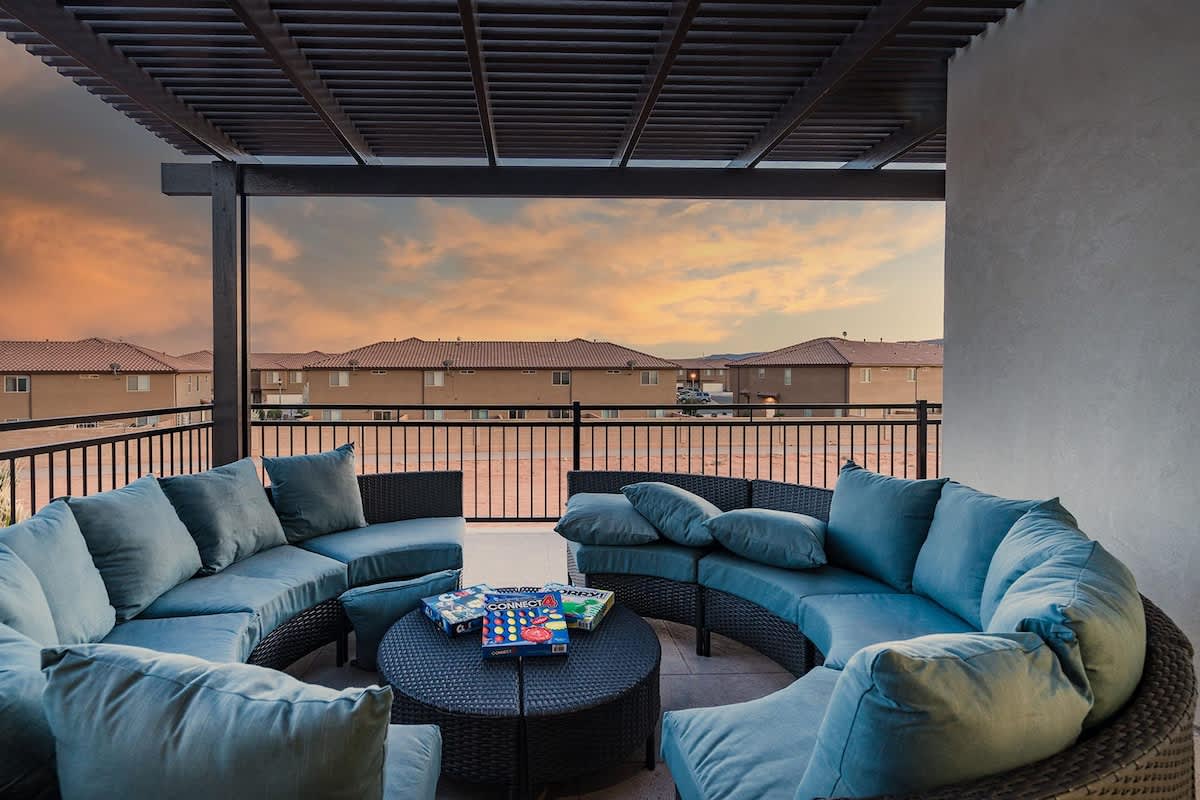 #52 - Entertainment balcony with circular sectionals and pergola