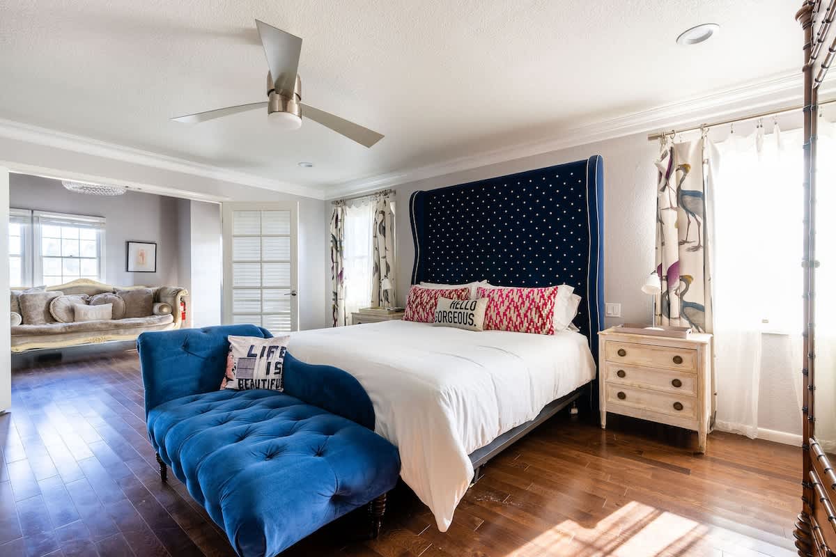 Retreat to the Notting Hill Master Suite upstairs—featuring a plush king bed, elegant lounge seating, and sun-filled windows. Perfect for couples seeking romance, executives needing quiet, or families wanting extra comfort.