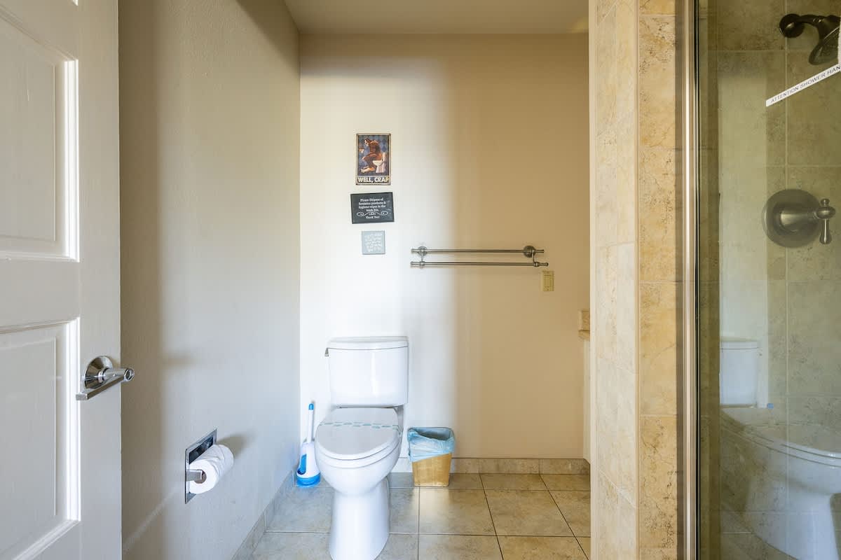 This en-suite bathroom offers a walk-in shower, modern vanity, and private toilet area. Designed for convenience and comfort, it’s exclusively attached to the Highbury & Islington Bedroom for a private retreat.