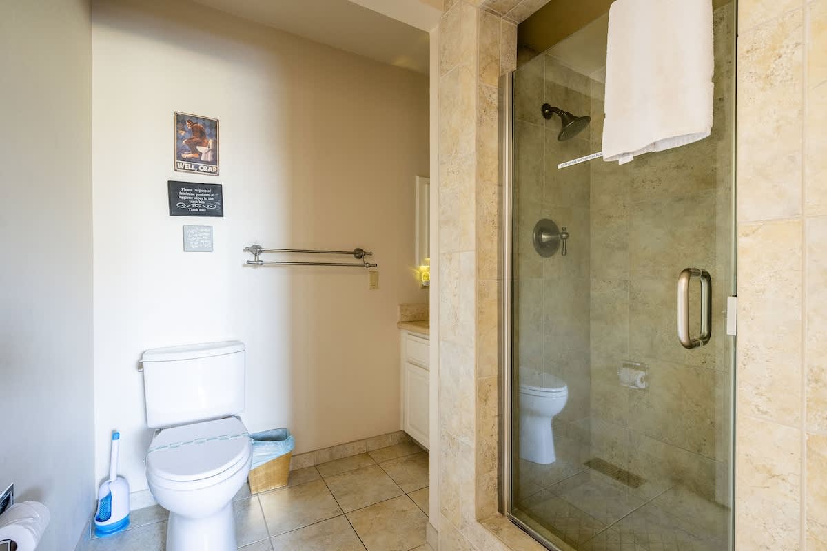Full en-suite bathroom featuring a walk-in shower, vanity, and all essential amenities. Conveniently attached to the Highbury & Islington Bedroom for added comfort and privacy.