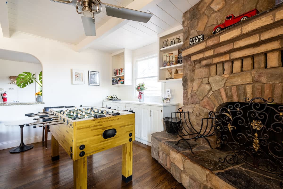 Challenge friends to a foosball match or gather by the rustic stone fireplace—perfect for families, wine lovers, and team retreats alike.