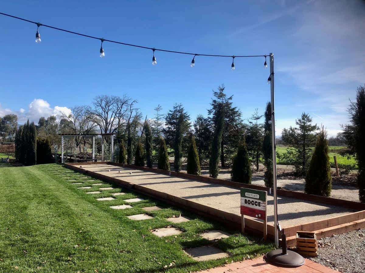 Enjoy friendly games on the private bocce court with twinkling lights above—perfect for families, wine lovers, golfers, and corporate groups looking to unwind in the heart of San Martin wine country.