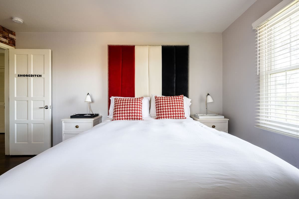 Shoreditch Bedroom offers a sleek queen bed with modern design and plenty of natural light—perfect for business travelers or couples seeking a stylish retreat upstairs.